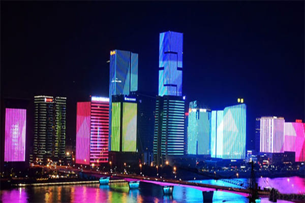 A building facade lit with dynamic, colorful programmable LEDs